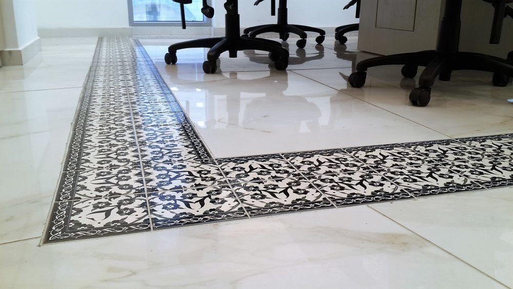 Hand decorated black and white tiles for the floor