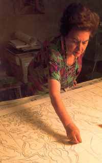 Marie Balian preparing one of her artistic tile paintings