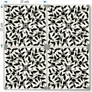 four decorative floral black and white tiles together