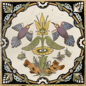 A Minton Hollins 6x6 ceramic tile with boirds and a floral pattern