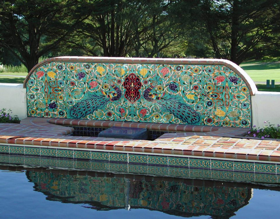 A ceramic tile mural with porcelain tiles by a pool with Balian waterline pool tiles