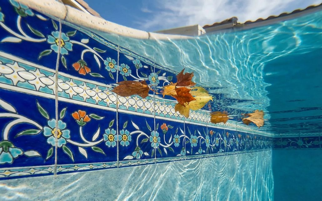 Two rows of Balian waterline pool tiles for a stunning pool tile design idea